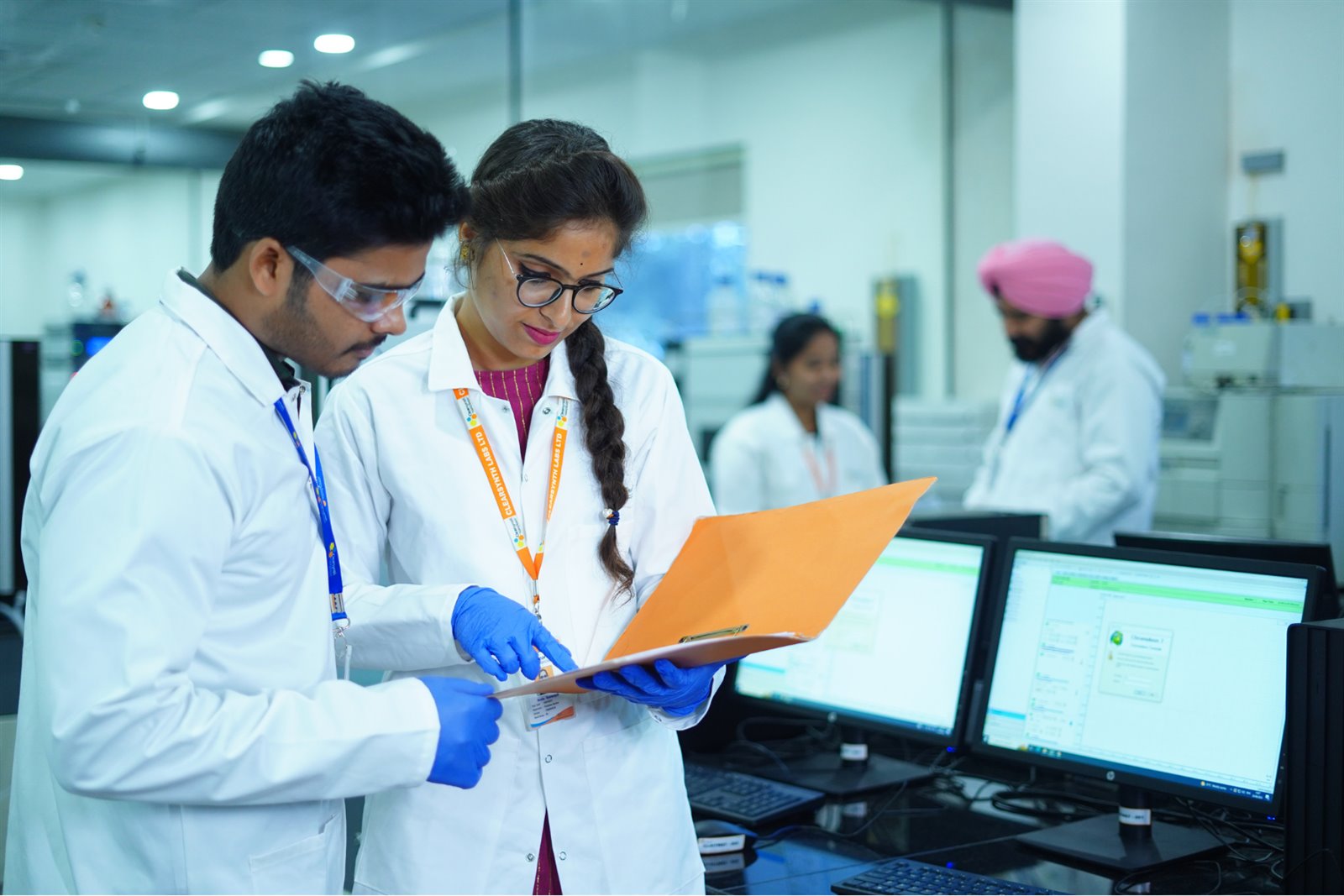 Clearsynth scientists reviewing laboratory documentation for API development